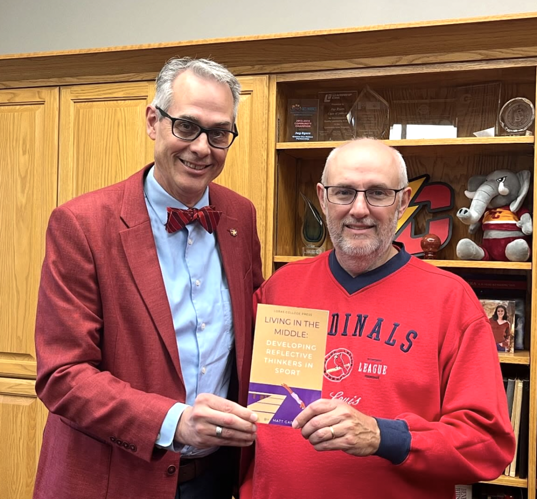 Matt Garrett and President Byers with Garret's new book